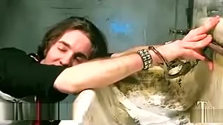 Busty tranny fucks guy in asshole in public toilet