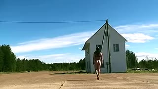 Velena walks naked on the road in a public